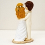 Figure de mariés sur la plage pour gâteau de mariage original