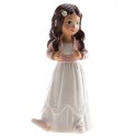 Figure de gâteau fille brune avec veste rose et baskets de sport