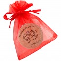 Miroir personnalisé pour mariage avec nom et date présenté dans un sac en organza rouge
