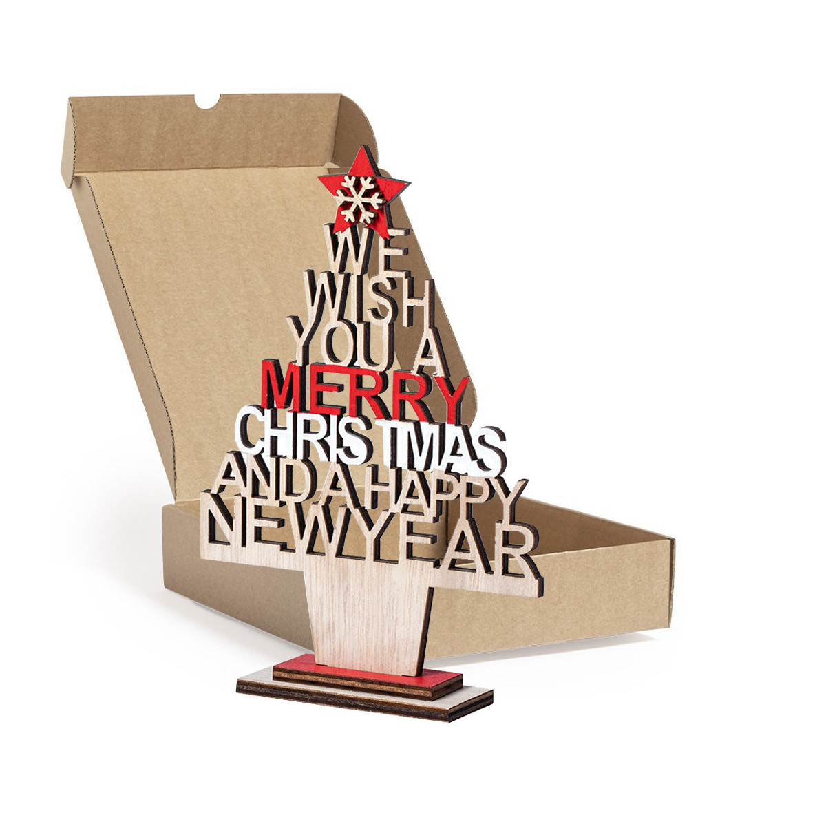 Petit sapin de noël sur la table présenté dans une boîte en carton carrée