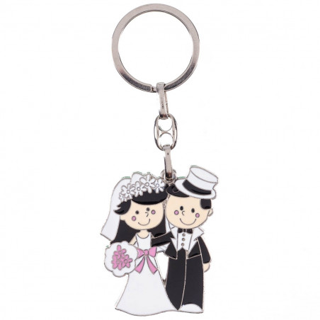 Porte clés pour couple de mariage présenté dans un sac en tissu rustique blanc