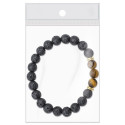 Pot en terre cuite avec des graines et bracelet en pierre volcanique comme cadeau