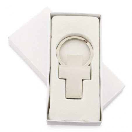 Serviette en forme de chien et porte-clés croix argentée dans une boîte personnalisée pour événements