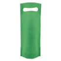 Vin personnalisé avec étiquette ronde de première communion enfant personnalisé présenté dans un sac vert