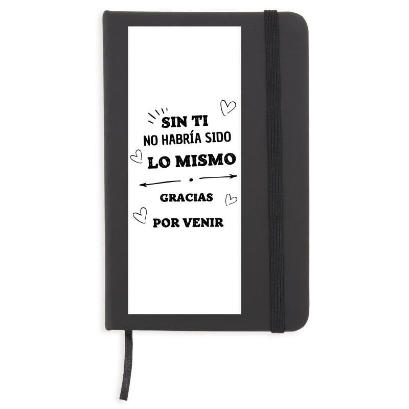 Cahier noir avec des feuilles blanches avec un autocollant de gratitude