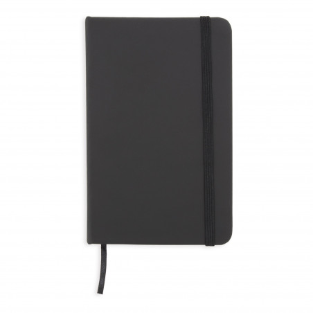 Cahier noir avec des feuilles blanches avec un autocollant de gratitude