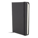 Cahier noir avec des feuilles blanches avec un autocollant de gratitude