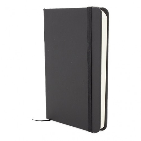 Cahier noir avec des feuilles blanches avec un autocollant de gratitude