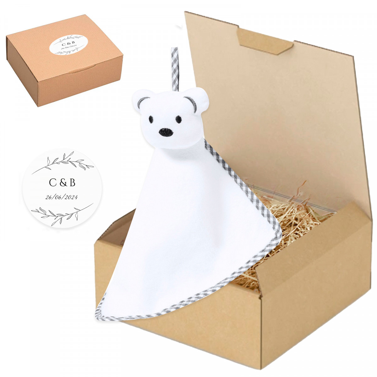 Doudou en peluche pour bébé présenté dans une boîte personnalisée pour plus de détails