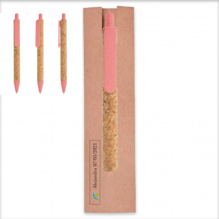 Stylo en paille de blé rose dans un étui avec un autocollant de baptême pour plus de détails