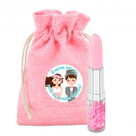 Stylo rouge à lèvres dans un sac en toile rose avec adhésif personnalisé pour les détails