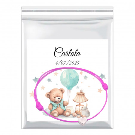 Bracelet coeur en fil rose avec carte de baptême personnalisée dans un sac de présentation