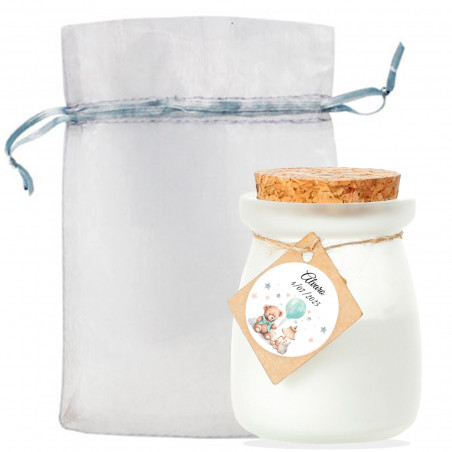 Bougie en verre avec couvercle personnalisé dans un sac en organza pour cadeaux de baptême