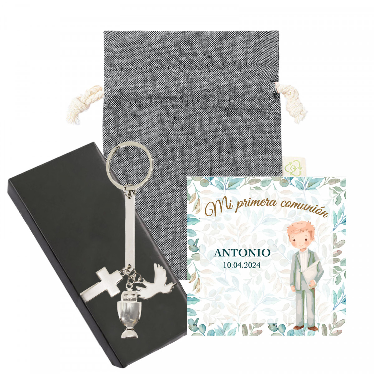Porte-clés argenté avec charm de communion dans un étui de présentation et un sac noir en coton avec une carte pour la