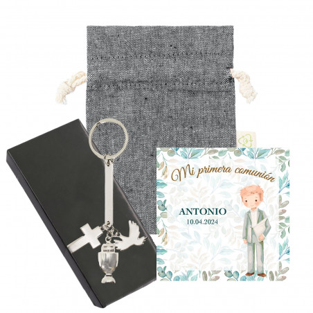 Porte-clés argenté avec charm de communion dans un étui de présentation et un sac noir en coton avec une carte pour la
