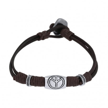 Bracelet en cuir avec le symbole de la paix présenté avec une enveloppe pour baptême