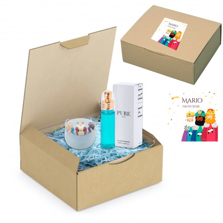 Parfum et boîte métallisée des rois mages dans une boîte de présentation avec un autocollant personnalisé pour un cadeau de Noël