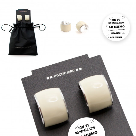 Boucles d'oreilles Antonio Miró avec autocollant de remerciement dans un sac pour des cadeaux.