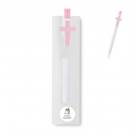 Stylo avec croix présenté dans une housse blanche et personnalisé avec un autocollant de licorne