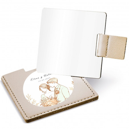 Miroir dans un étui doré avec autocollant design mariés pour des détails de mariage