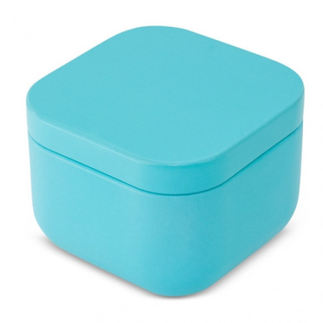Bougie dans une boîte métallique turquoise avec carte personnalisée dans un sac en organza blanc pour un souvenir de baptême