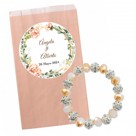 Bracelet brillant dans une enveloppe en papier rose pastel avec autocollant floral personnalisable