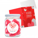 Bonbons en chocolat dans un pot personnalisé avec une carte "Je t'aime beaucoup" à offrir