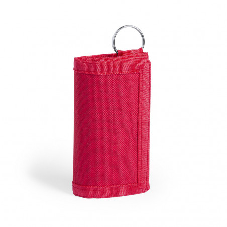 Porte-clés portefeuille rouge présenté avec une enveloppe et un autocollant de remerciement pour les invités