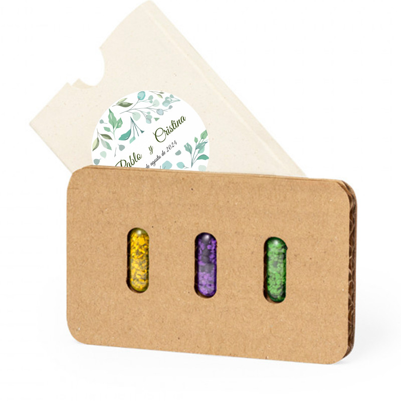 Graine en capsules présentées dans un étui avec un autocollant personnalisable pour des détails écologiques