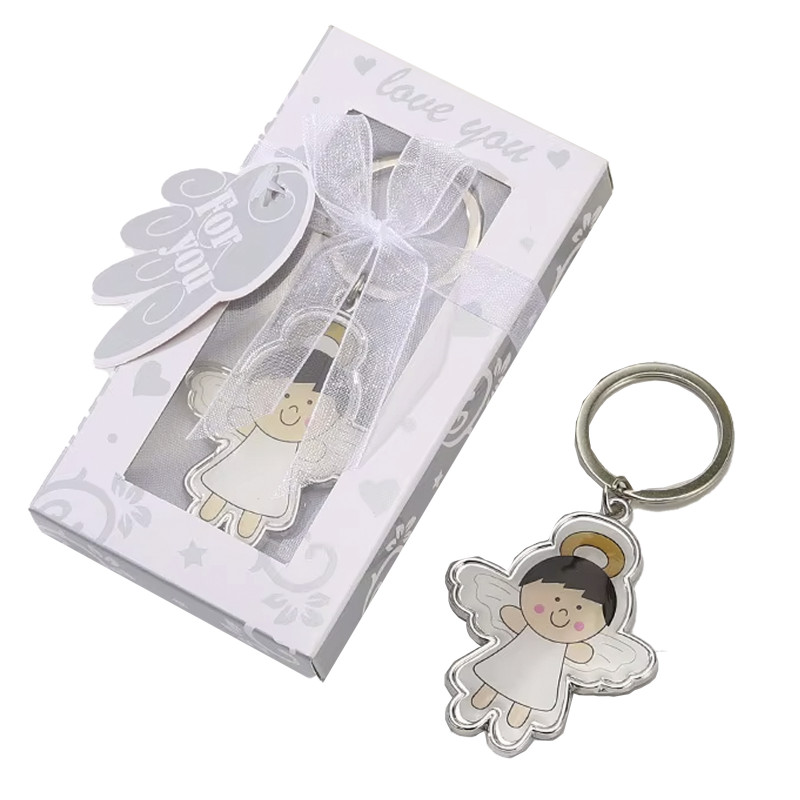 Porte-clés ange souriant avec ailes présenté dans une boîte cadeau