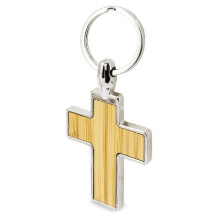 Porte-clés en forme de croix en métal avec bambou dans une boîte personnalisée avec un autocollant de baptême pour un détail.