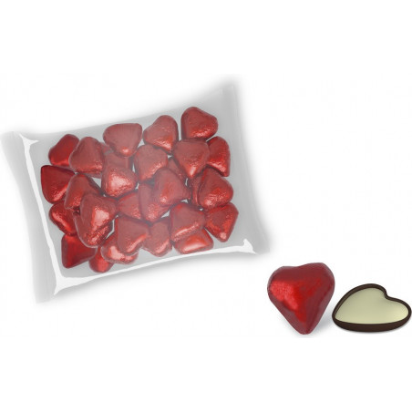 Pompero et bonbons en forme de cœur dans un sac transparent avec une carte de souvenir de mariage
