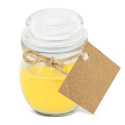 Bougie parfumée jaune dans un pot en verre avec une étiquette personnalisable au design d'éléphant pour un baptême