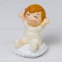 Figure baby pop & fun assis sur un coussin