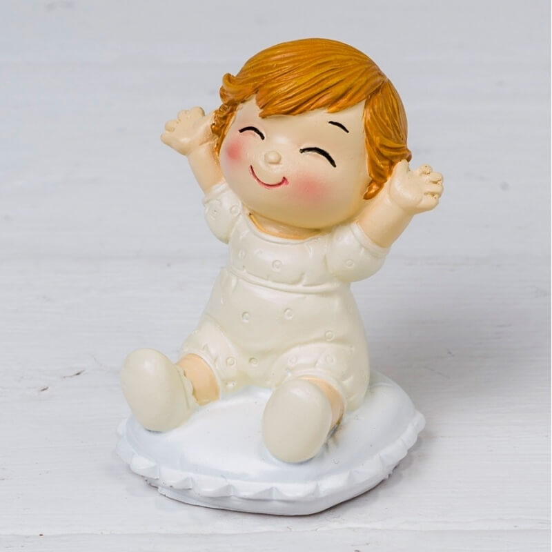 Figure baby pop & fun assis sur un coussin